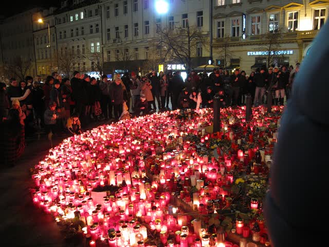 Candles burn during a vigil. (File photo)