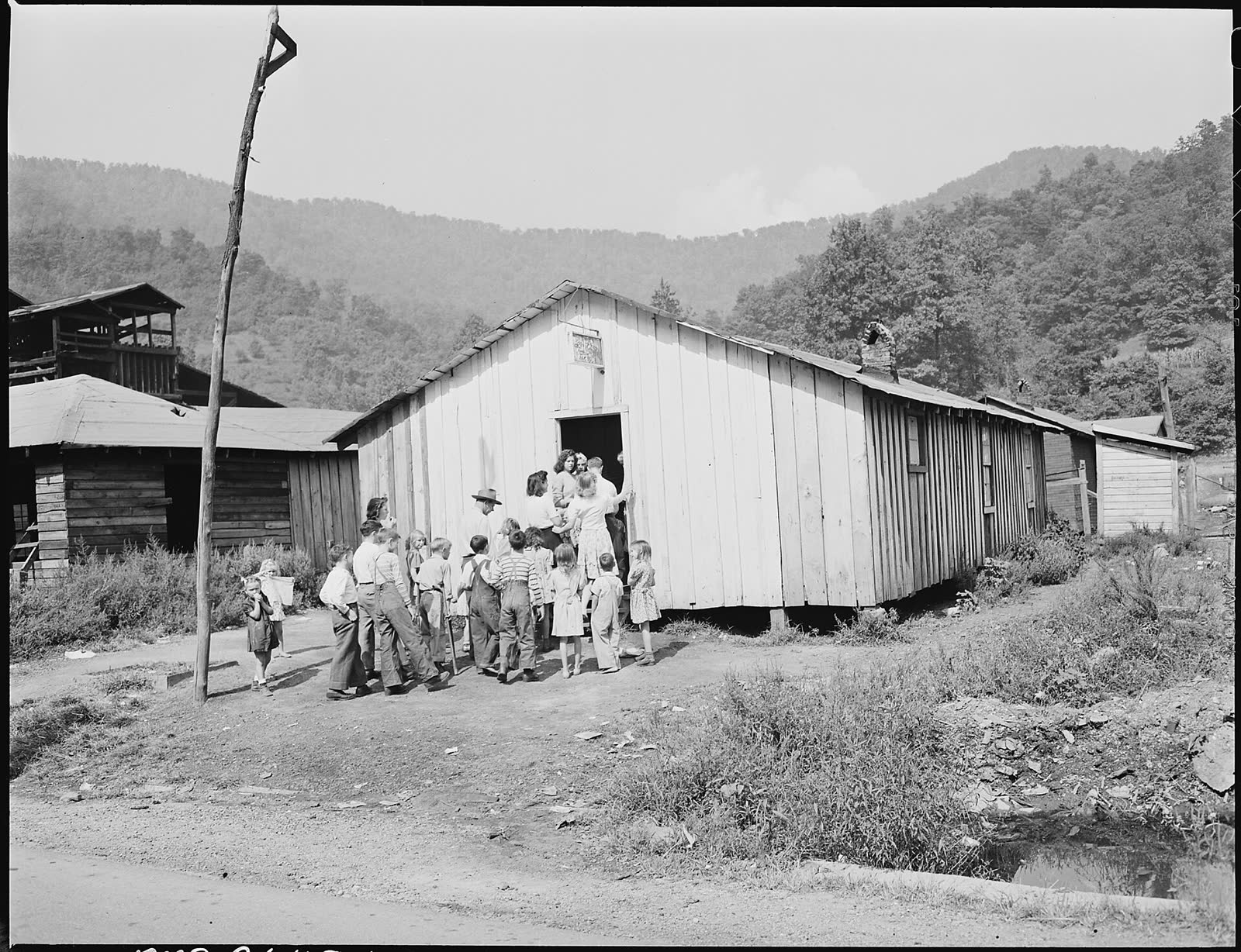 People going to Sunday school at the Pentecostal Church of God in Lejunior, Harlan County, Ky., in 1946. (File photo)