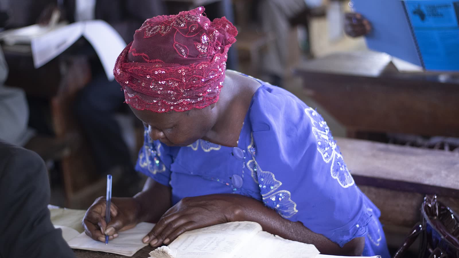 A woman reads Scripture during a church service. (File photo)